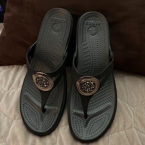 Croc sandals with design in strap.